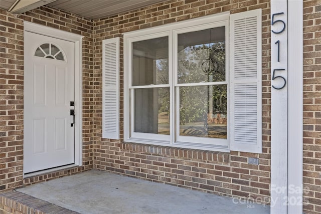 doorway to property with a patio area