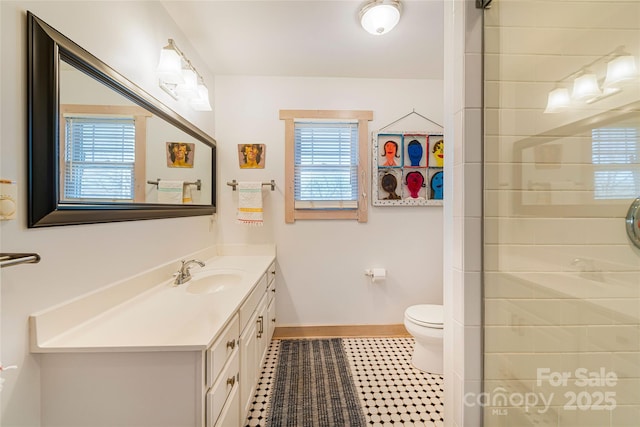 14 Drake St, Asheville, NC 28806 - full bathroom featuring baseboards, vanity, toilet, and a tile shower
