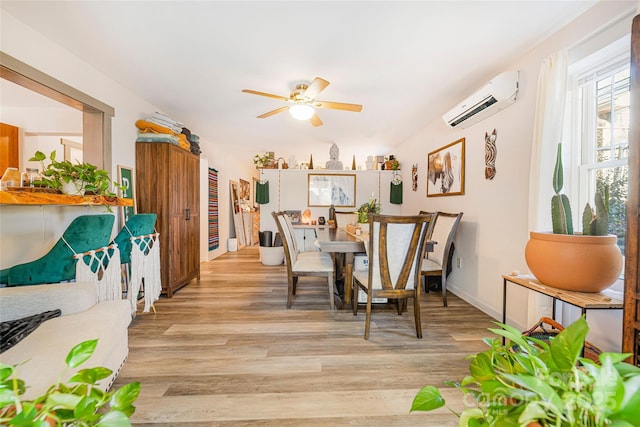 14 Drake St, Asheville, NC 28806 - dining area with a wall mounted air conditioner, light wood finished floors, a ceiling fan, and baseboards