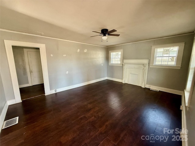 unfurnished living room featuring ceiling fan, crown molding, and dark hardwood / wood-style flooring