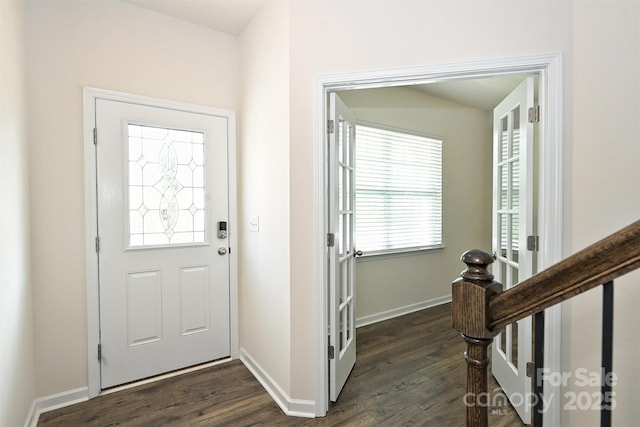 foyer entrance featuring dark hardwood / wood-style floors