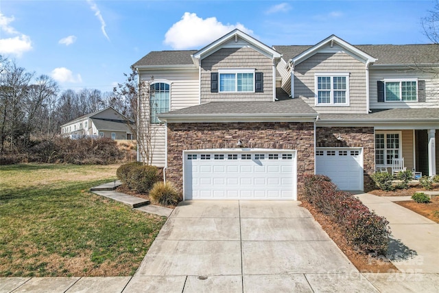 view of front of property featuring a garage and a front yard