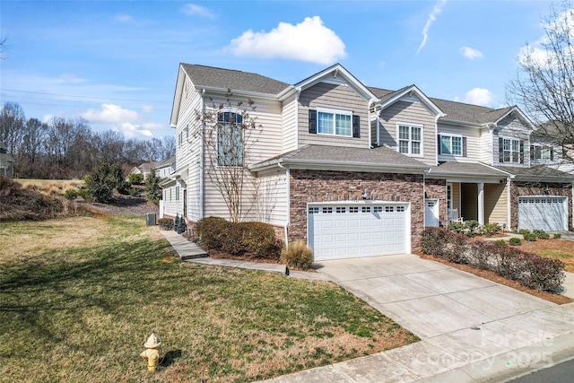 view of front of house featuring a garage and a front lawn