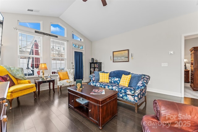 living room featuring dark wood-type flooring, ceiling fan, and vaulted ceiling