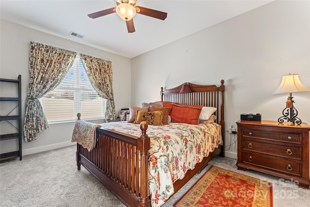 bedroom featuring light colored carpet and ceiling fan