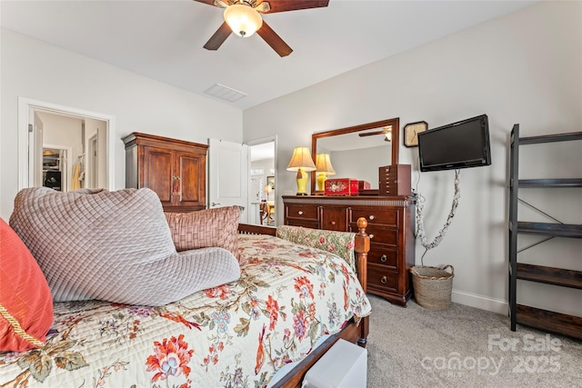 bedroom featuring ceiling fan and light colored carpet