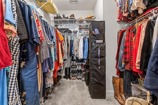 spacious closet with carpet flooring