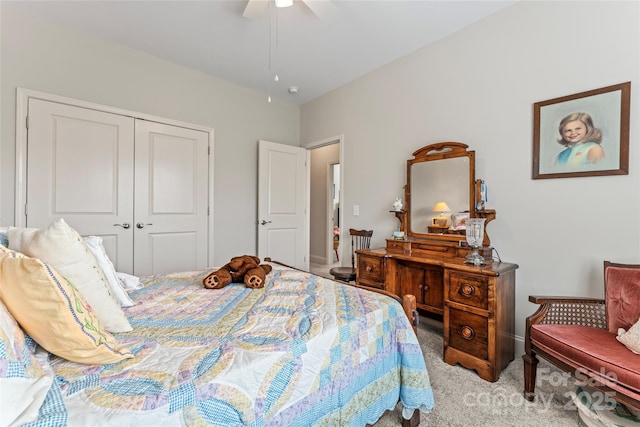 carpeted bedroom featuring a closet and ceiling fan