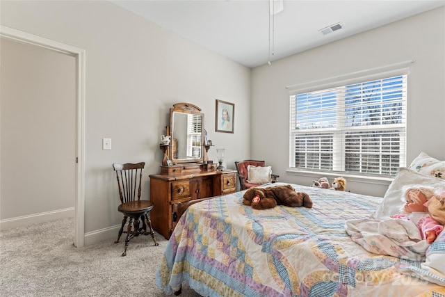 bedroom featuring light carpet