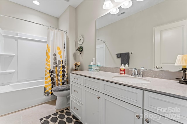 full bathroom with tile patterned floors, vanity, toilet, and shower / bath combo with shower curtain