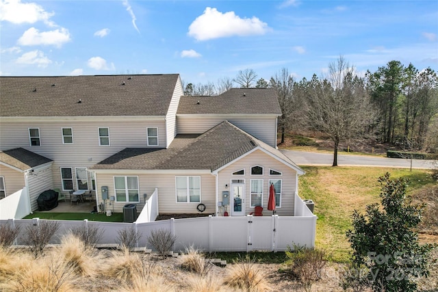 rear view of property with central air condition unit