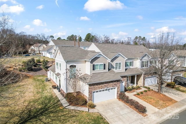 view of front of home featuring a garage, cooling unit, and a front lawn