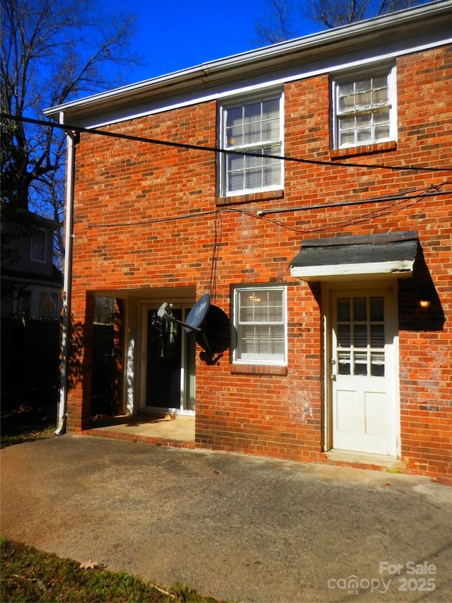 view of front of home featuring brick siding