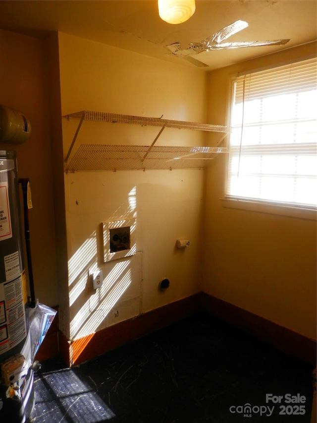 washroom featuring water heater and hookup for an electric dryer