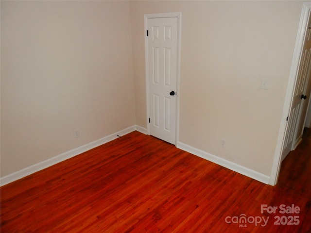 101 Colony Acres Dr, Charlotte, NC 28217 - spare room featuring baseboards and dark wood-type flooring