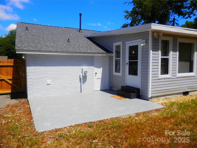 101 Colony Acres Dr, Charlotte, NC 28217 - rear view of property featuring a patio, entry steps, a shingled roof, and brick siding