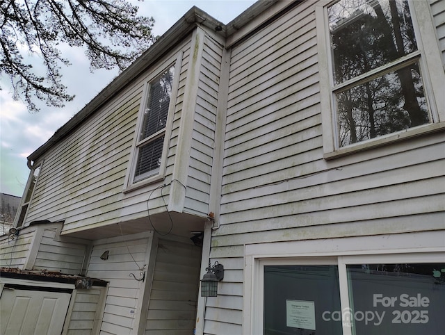 view of side of home featuring a garage