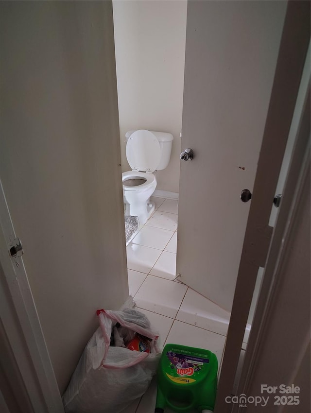 bathroom with tile patterned floors and toilet