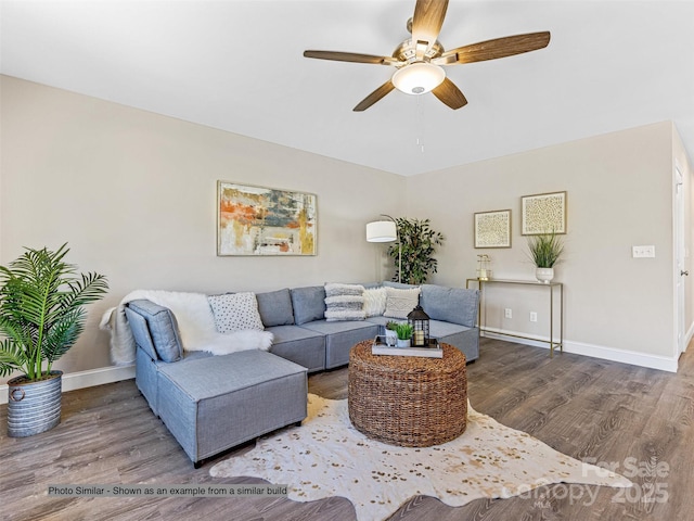 living area with wood finished floors, baseboards, and ceiling fan