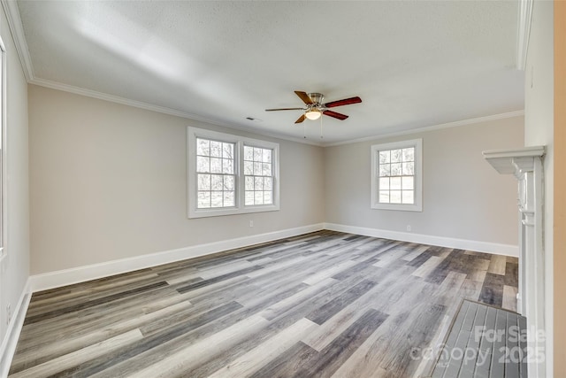 spare room with crown molding, a textured ceiling, ceiling fan, and light wood-type flooring