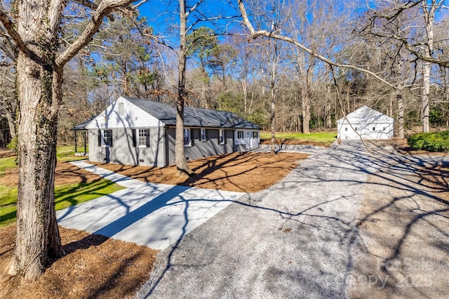 view of front of house with an outbuilding and a garage