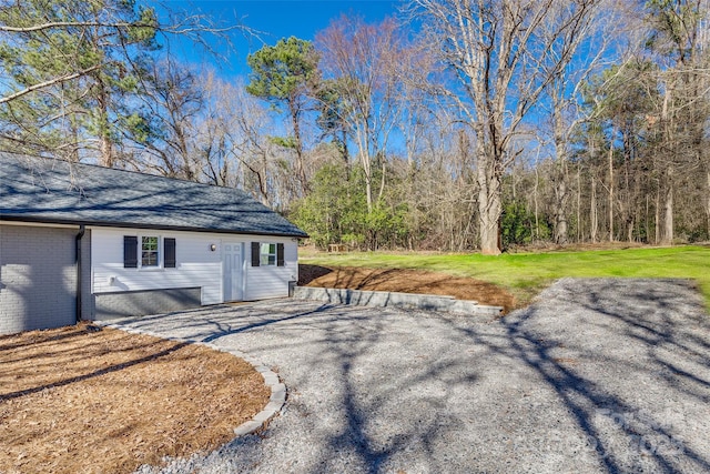 2478 Stribling Cir, Lancaster, SC 29720 - view of home's exterior with roof with shingles, brick siding, and a lawn