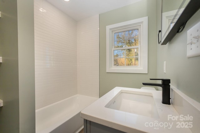 bathroom featuring vanity and washtub / shower combination