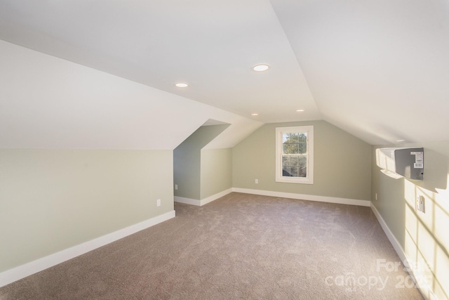 bonus room featuring lofted ceiling and carpet