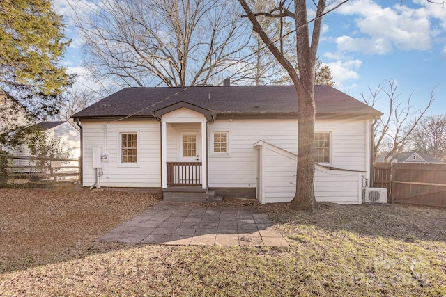 rear view of property featuring a patio