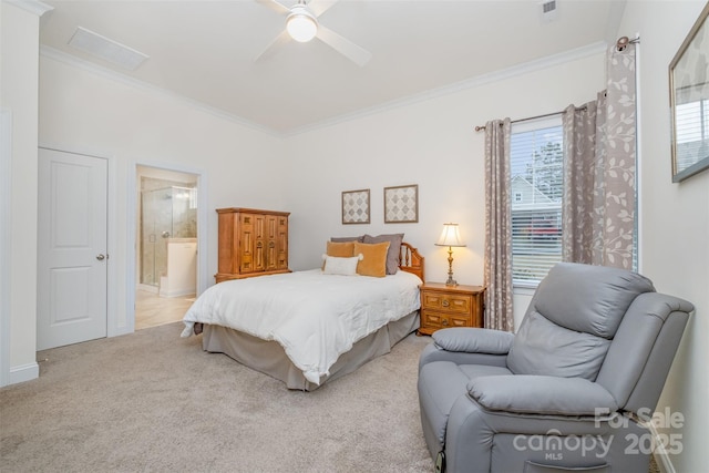 carpeted bedroom featuring ceiling fan, ensuite bath, and ornamental molding