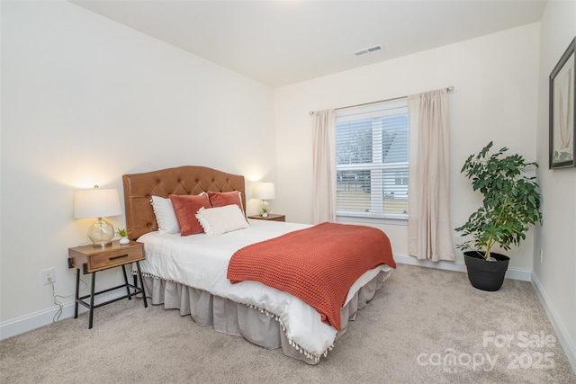 bedroom with light colored carpet