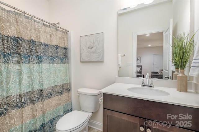 bathroom with vanity and toilet