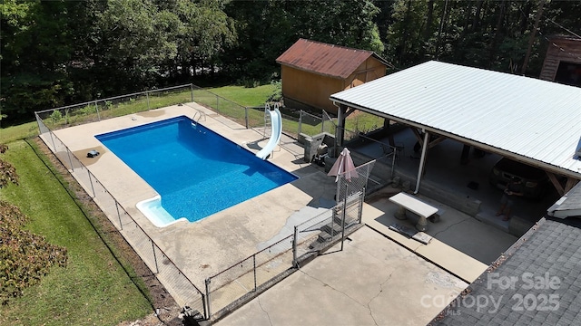 255 Wildwood Rd, Lenoir, NC 28645 - view of pool featuring a yard, a water slide, a fenced backyard, a patio, and a fenced in pool