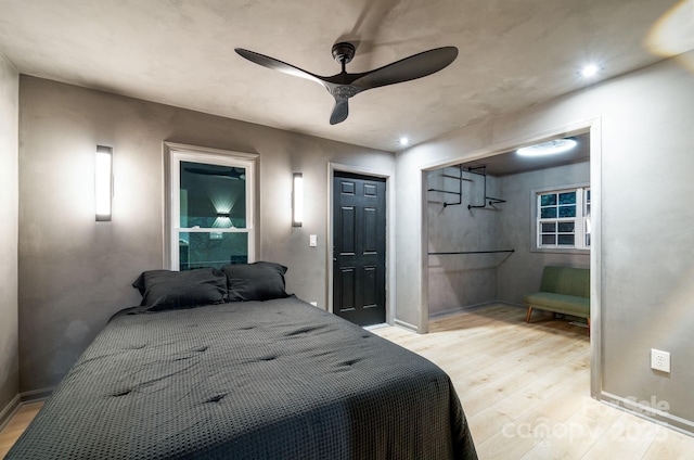 bedroom featuring ceiling fan and light wood-type flooring