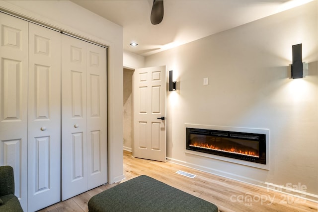 unfurnished bedroom featuring hardwood / wood-style floors and a closet