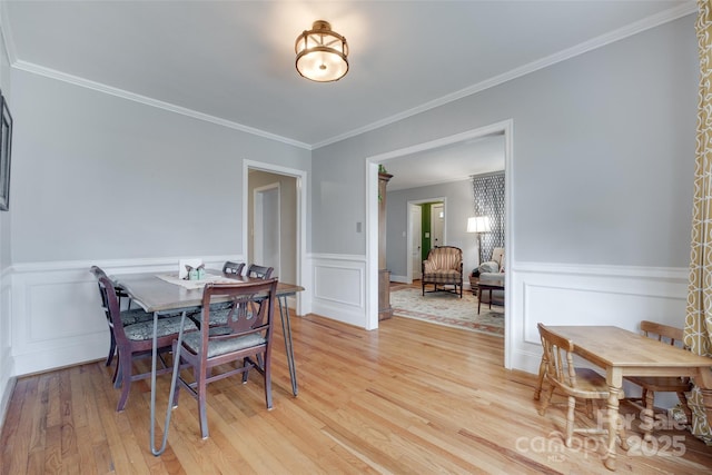 968 Waverly Ave, Rock Hill, SC 29730 - dining area with light wood-type flooring, a wainscoted wall, and crown molding