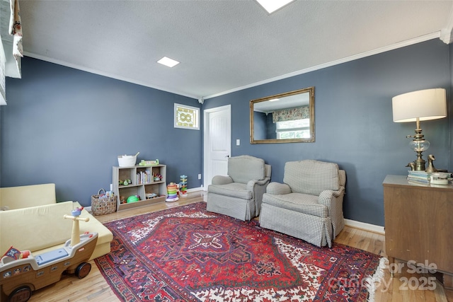 968 Waverly Ave, Rock Hill, SC 29730 - living area with wood finished floors, crown molding, a textured ceiling, and baseboards
