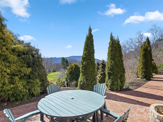 view of patio / terrace featuring a mountain view