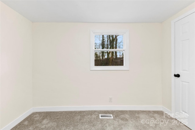 empty room featuring light carpet