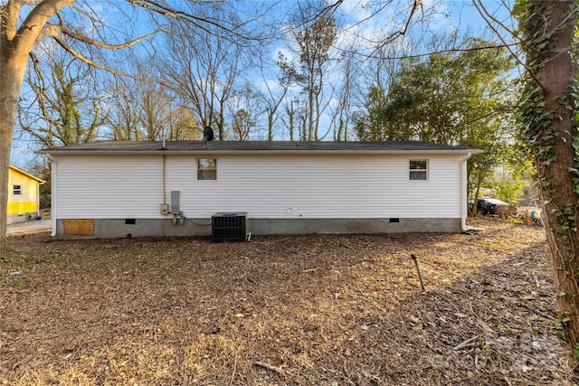 rear view of house with central AC