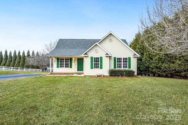 ranch-style home featuring a front yard