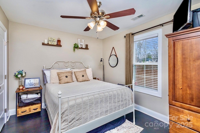 bedroom featuring dark hardwood / wood-style floors and ceiling fan