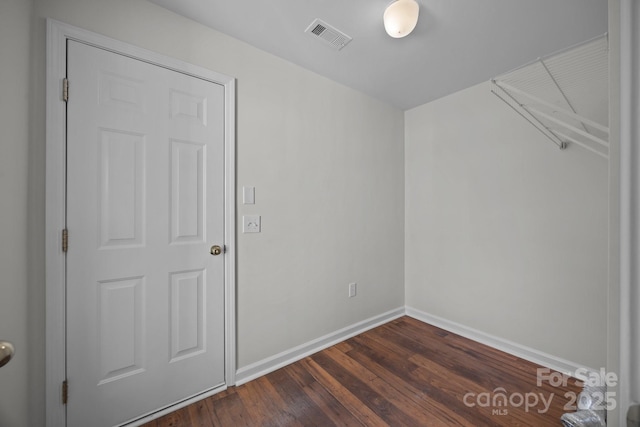 spare room featuring dark hardwood / wood-style flooring