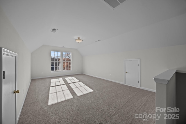 bonus room featuring lofted ceiling and carpet floors