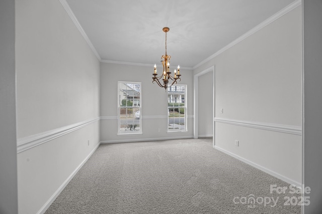 empty room featuring a notable chandelier, carpet floors, and ornamental molding