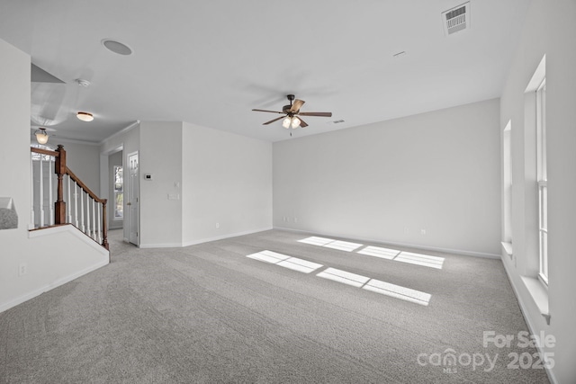 unfurnished living room with light carpet and ceiling fan