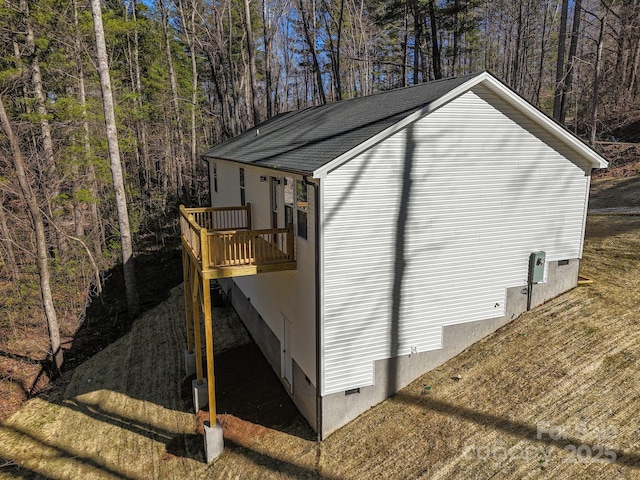 view of outbuilding featuring a forest view