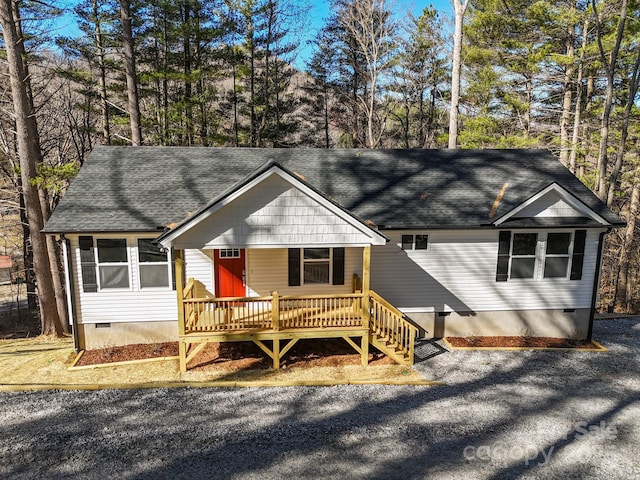 view of front of house featuring a porch, roof with shingles, and crawl space