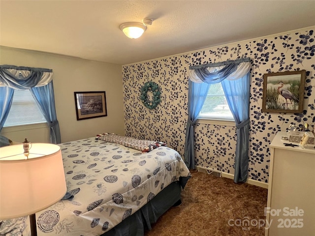 bedroom with dark carpet