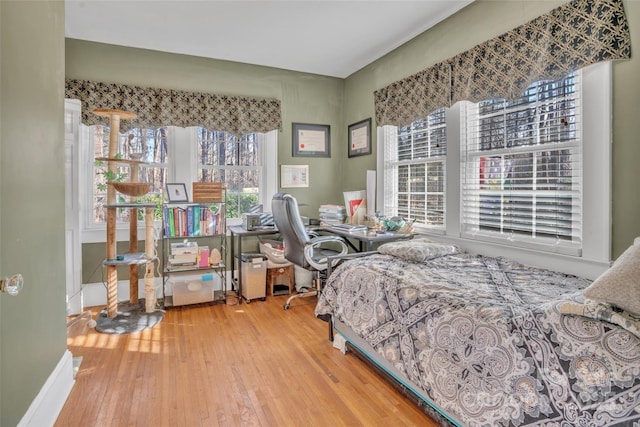 bedroom with hardwood / wood-style flooring